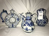 Front view of all three blue and white porcelain pieces