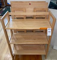 Front view of one bookcase open with others folded behind