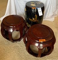 Two hardwood drum stands and lacquered garden stool together