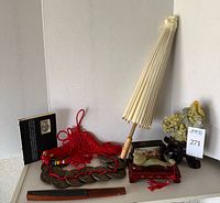Group shot showing all items including parasol, diorama, ruyi, coin tassel, fan, soapstone figure, book