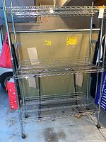 Full view of chrome wire shelving unit with three shelves