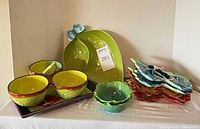 group view: leaf platter, bowls on tray, scalloped bowl, stacked wavy plates