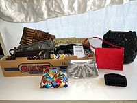 Group shot showing all purses in box and on table