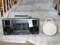 Front view of Hitachi TRK-9100H boombox and Jacky Wu speaker