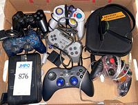 Box showing all controllers, headset case and adapter