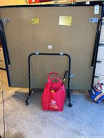Folded Harvard ping-pong table rear view with accessories tote underneath