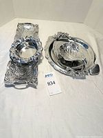 All three aluminum serve pieces displayed: rectangular tray, lazy susan with glass inserts, small bowl