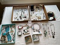Full lot overview on table showing all jewelry pieces