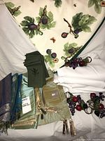 Assorted linens and napkin rings laid out