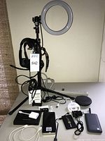 Full lot – ring light on tripod, headsets, power banks, chargers