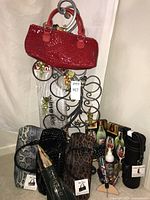 Full lot overview showing rack, clutches, totes and accessories