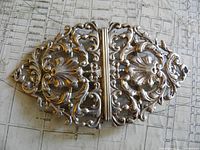 Full view of ornate two-piece sterling belt buckle