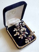 Brooch and earrings in blue velvet box