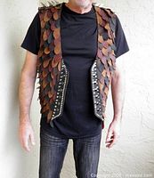 Front view of handmade leather vest worn on model