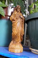 Full front view of carved olive wood Jesus statue