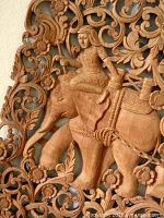 Close-up of carved elephant rider and floral detail