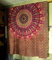 Full view of hanging textile showing overall size and pattern