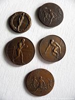 All five medals obverse showing sport scenes