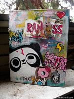 Front view of graffiti painting showing panda, heart, donut and text