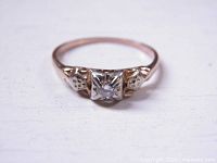 Front view of ring highlighting diamond and platinum mount