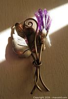 Front view showing leaf, stem and carved amethyst flower