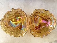 Top view of both Indiana Glass Loganberry marigold bowls showing iridescent finish and pattern