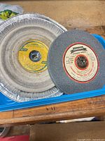 Two 6-inch grinding wheels, labels visible