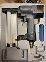 nailer in case showing full tool and magazine