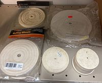 Group shot of all buffing wheels on shelf