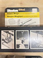 Front view of Disston Dowel Magic packaging card and accompanying instruction box