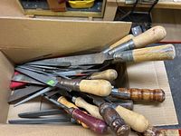 Box of assorted hand files showing quantity and variety