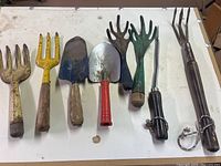All seven garden hand tools laid out for overview