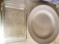 Top view of Pyrex glass baking dish and white H&H oval dish