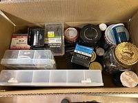 overview of cardboard box with all containers of fasteners
