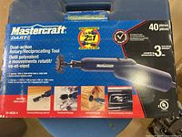 Front of retail box showing Mastercraft dual-action rotary/reciprocating tool and accessory details