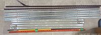 All metal brackets and tracks laid out to show quantity and length