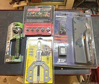 Front view of all four sealed tool packages