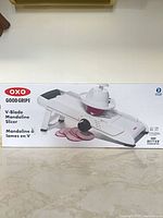 Front of sealed box showing OXO Good Grips V-Blade Mandoline Slicer