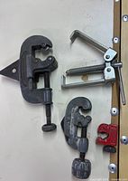 overview of four clamps and cutter