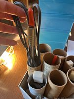 Group of Razertip woodburning tips bundled in cardboard tubes