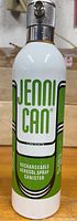 Front view of Jenni Can rechargeable aerosol spray canister showing branding and nozzle