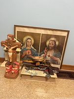 Group shot showing framed print, resin crucifix statue, figurines, wooden cross, rosaries, holy water font