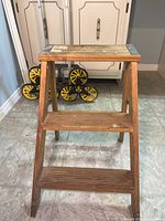 front view showing two steps, wood construction, metal corner caps