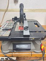 Front angled view showing Rockwell BladeRunner X2 saw, blade, table surface and Rockwell branding