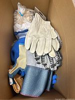 Gloves stacked inside open box