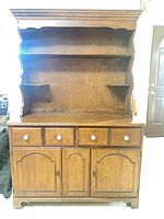 Full view of sugar maple hutch showing upper shelves, drawers, doors, casters