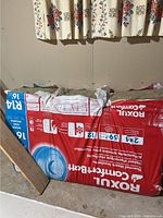 Front view of sealed Roxul ComfortBatt R14 insulation bag leaning against wall