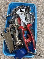 overall lot in blue tray showing wrench, tube cutters, clamps