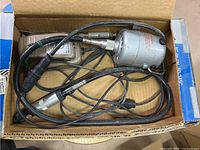 Motor, flexible shaft, handpiece and control unit inside box