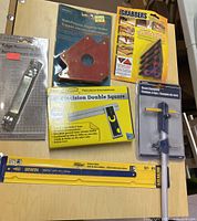 Overview of first group of six packaged tools on tabletop